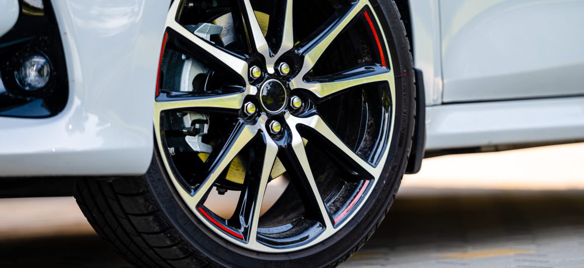 sports car wheels, low profile tires on aluminum rims, close-up, selective focus